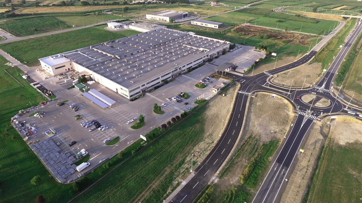 Aerial view of a large industrial campus and surrounding infrastructure